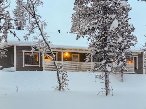 a house in the snow with a yard at Holiday Home Hilla b by Interhome in Saariselka