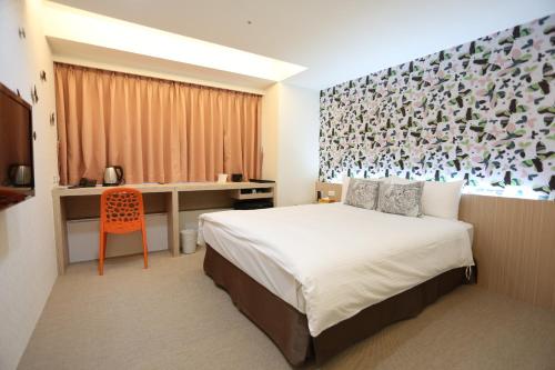 Tempat tidur dalam kamar di Morwing Hotel Fuzhong