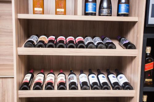 a bunch of wine bottles in a wine cellar at Barravento Praia Hotel in Ilhéus