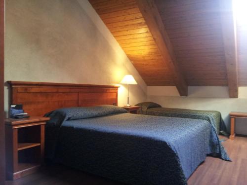 Postel nebo postele na pokoji v ubytování Hotel Clari