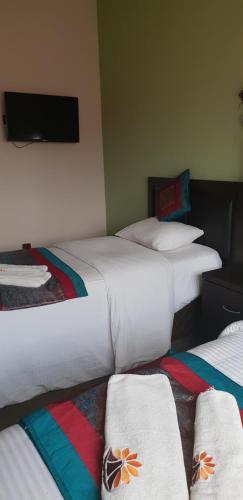 Cama ou camas em um quarto em Melsim Lodge