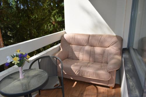 a leather chair and a table on a balcony at Paradise in Tampere