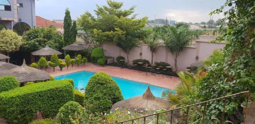 a view of a courtyard with a swimming pool at Melsim Lodge in Lusaka