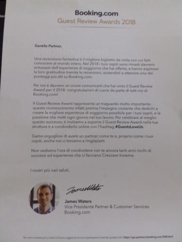 a letter from the clark review awards at Makos Guest House in Kutaisi
