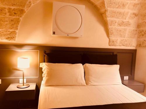 Postel nebo postele na pokoji v ubytování Dimora Santuzza