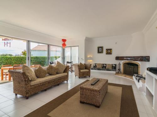 a living room with a couch and a fireplace at Villa Arribas Villa by Interhome in Patroves