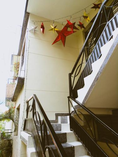 a stairway with stars hanging from a building at Selvática Alojamiento Eco in Medellín