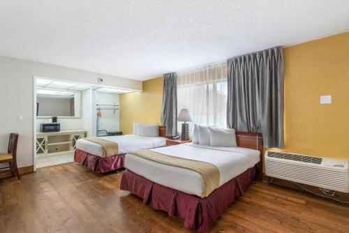 En eller flere senge i et værelse på Ocean Reef Hotel
