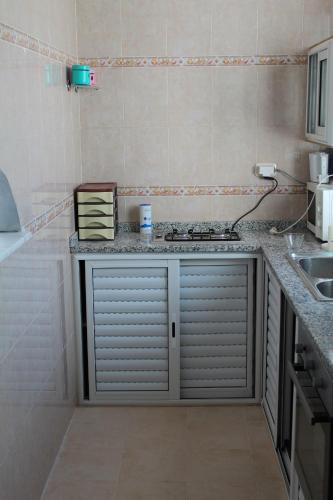 A cozinha ou cozinha compacta de City Apartment sur le port de Mahdia Free Wifi