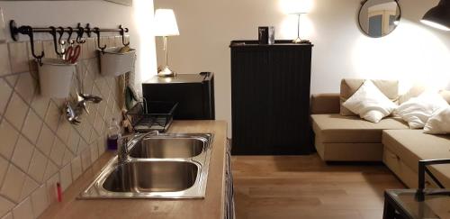 A kitchen or kitchenette at Butera Apartment