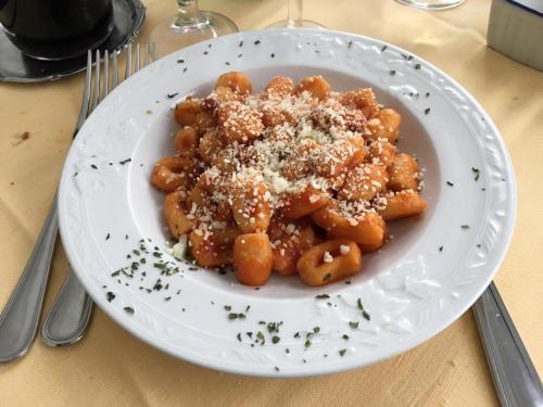 a plate of food with pasta on a table at Hotel La Congiura dei Baroni in Teggiano