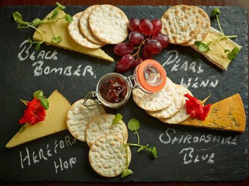 a group of cheese and crackers on a chalk board at The Lion in Leintwardine