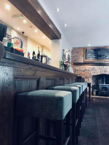 a row of seats at a bar in a restaurant at The Lion in Leintwardine
