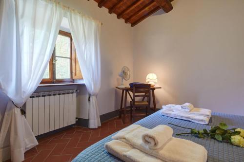 Ένα ή περισσότερα κρεβάτια σε δωμάτιο στο Borgo Santa Maria in Valle