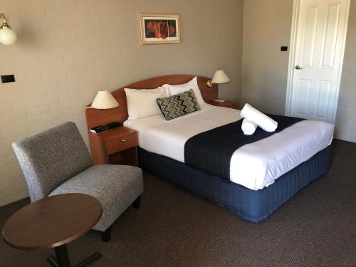 เตียงในห้องที่ Best Western Coachman's Inn Motel