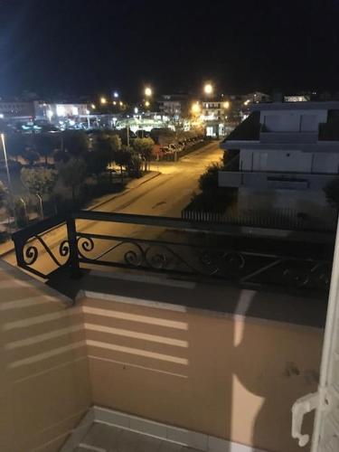 a view of a city at night from a balcony at Sun Beach in San Benedetto del Tronto