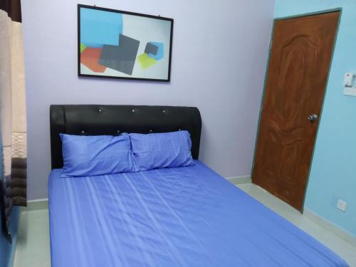 Postel nebo postele na pokoji v ubytování DZe Homestay Singkir Genting