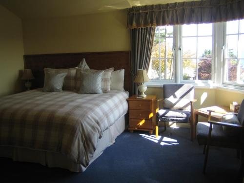 Кровать или кровати в номере Lamorna Lodge