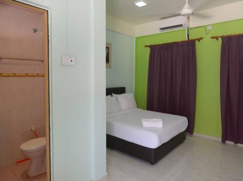 Katil atau katil-katil dalam bilik di Delima Redang Resort