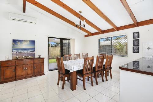 a kitchen and dining room with a table and chairs at Michael Street 39 Golden Beach in Caloundra
