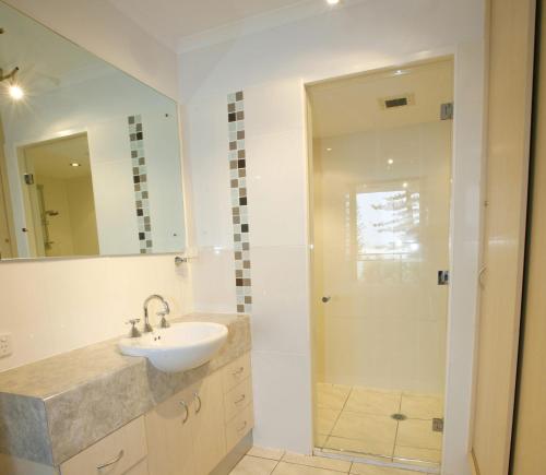 a bathroom with a sink and a shower at Allamanda U2 Awesome Location in Caloundra