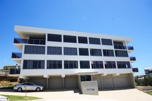 a building with a car parked in front of it at Pacific Towers Unit 4, 19 Ormonde Tce Kings Beach in Caloundra