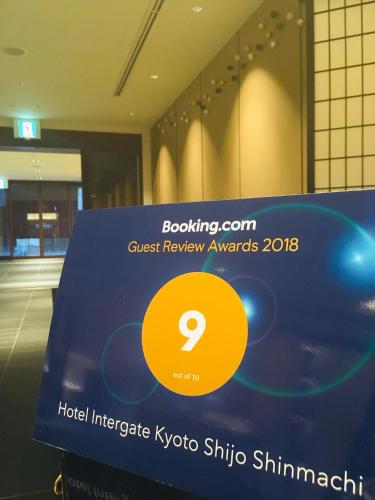 a sign for a guest review awards in a building at Hotel Intergate Kyoto Shijo Shinmachi in Kyoto