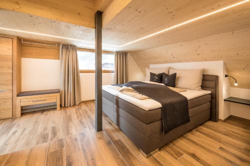 מיטה או מיטות בחדר ב-XL Appartements Sand in Taufers