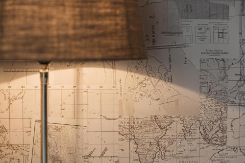 a lamp in front of a map of the world at Hotel Cocoon in Ostend