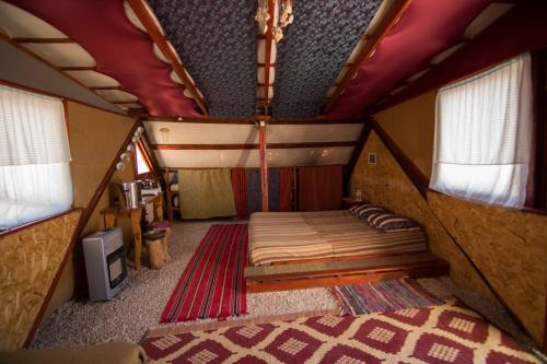 A bed or beds in a room at Succah in the Desert