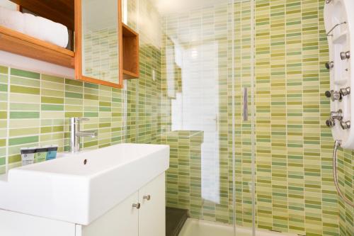 a bathroom with a sink and a shower at SANTS STATION PENTHOUSE in Barcelona