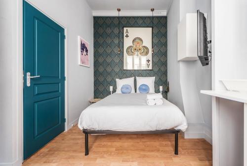 Postel nebo postele na pokoji v ubytování Apartments WS Saint-Lazare - Opera