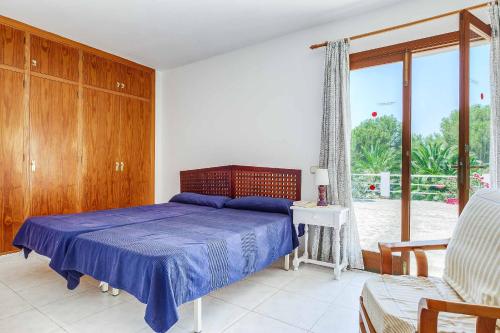 Posteľ alebo postele v izbe v ubytovaní Villa Punta des Port Quince