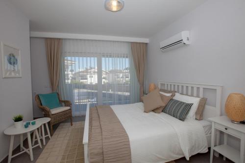 Ένα ή περισσότερα κρεβάτια σε δωμάτιο στο Truemar Hotels & Suites