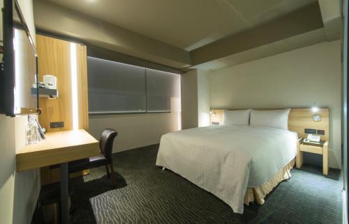 Un ou plusieurs lits dans un hébergement de l'établissement Simple + Hotel