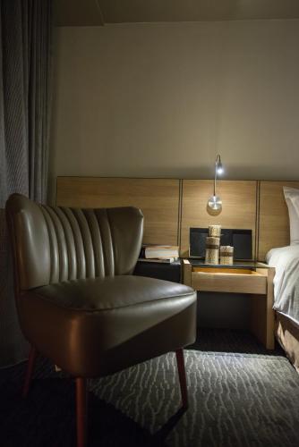 Un ou plusieurs lits dans un hébergement de l'établissement Simple + Hotel