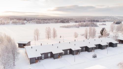 an aerial view of a building covered in snow at Riverside luxury suites in Rovaniemi