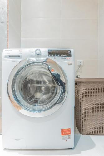 a washing machine is sitting in a room at Gunpost Suite in Valletta