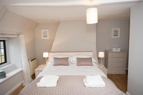 Posteľ alebo postele v izbe v ubytovaní Rutland Water Courtyard Rooms