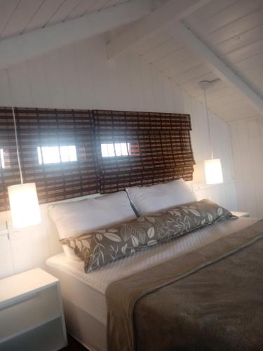 Postel nebo postele na pokoji v ubytování Praia do Rosa para casais
