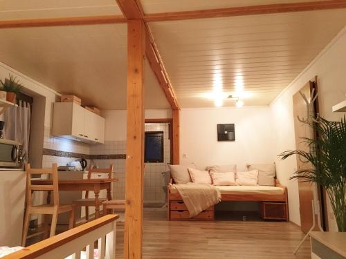 a living room with a couch and a table at Ferienhaus am Kagerstein in Neukirchen beim Heiligen Blut