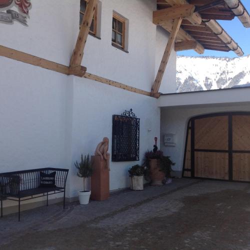a room with a building with a wooden ceiling at Landhaus Schwarz in Mieming