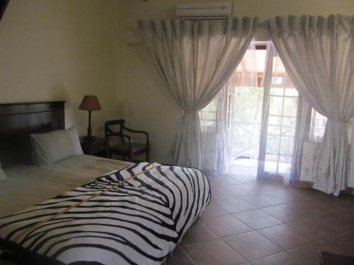 Katil atau katil-katil dalam bilik di The Woodsman Bed and Breakfast