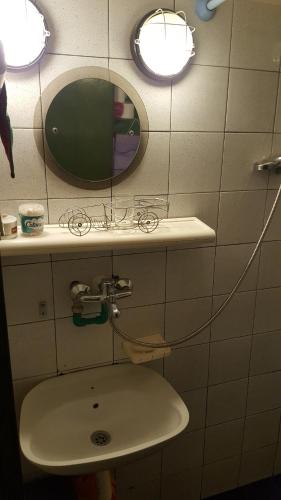 a bathroom with a sink and a mirror at GreenPointMountainHouse for 6 persons in Kopaonik