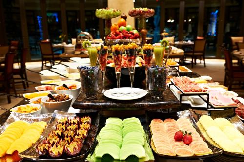 a buffet line with many different types of food at Peermont D'oreale Grande at Emperors Palace in Kempton Park
