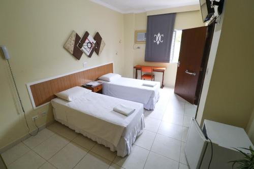 Katil atau katil-katil dalam bilik di Charme Hotel Guarujá Frente Mar