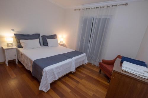 Ένα ή περισσότερα κρεβάτια σε δωμάτιο στο Apartments Madeira