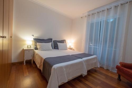 Ένα ή περισσότερα κρεβάτια σε δωμάτιο στο Apartments Madeira