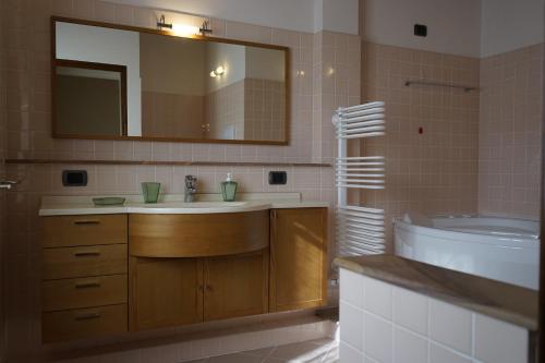 a bathroom with a sink and a mirror at La Vedetta in Lucca