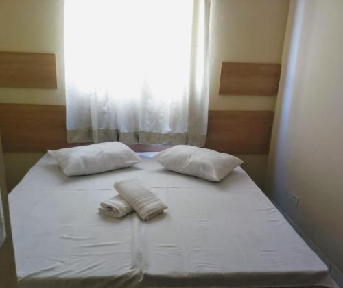 A bed or beds in a room at Acomodações Silvestre